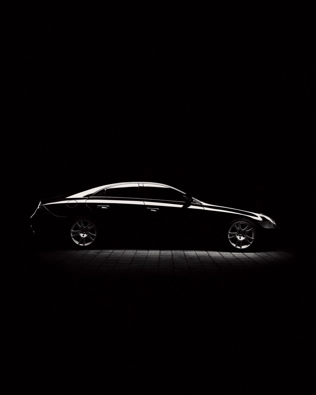 Black Mercedes-Benz CLS in a studio
