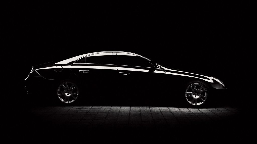 Black Mercedes-Benz CLS in profile under low studio light — Wolf Performance comes to drivers across Toronto, the GTA and Barrie
