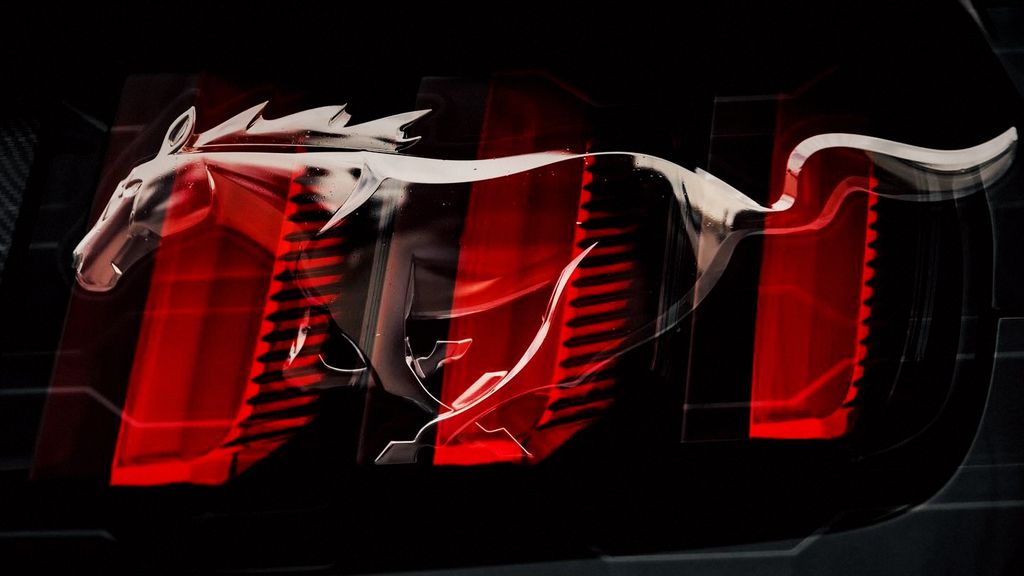 Close-up of a Ford Mustang tail light glowing red