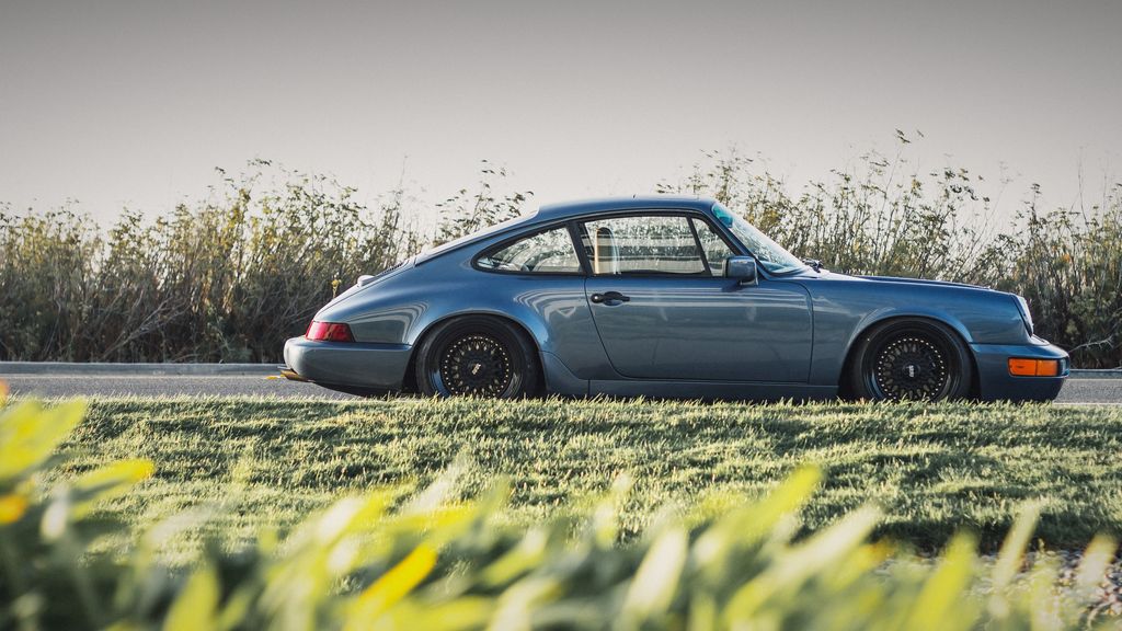 Classic Porsche 911 in profile at golden hour — car tuning Burlington by Wolf Performance