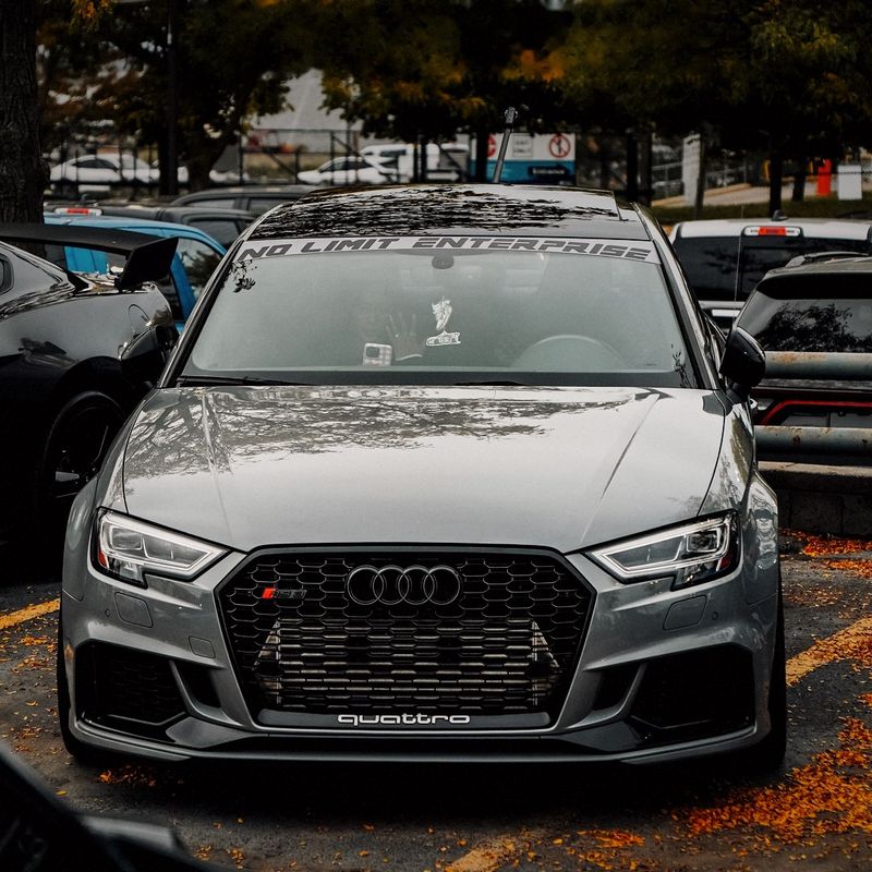 Grey Audi RS3, front three-quarter view